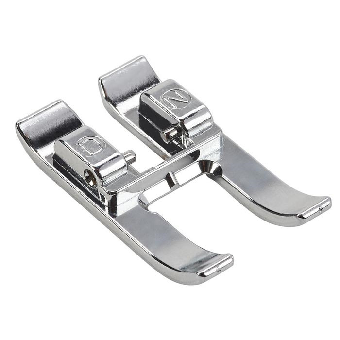 Pied broderie ouvert entraîn biface "DN" Pied broderie ouvert entraîn biface "DN"